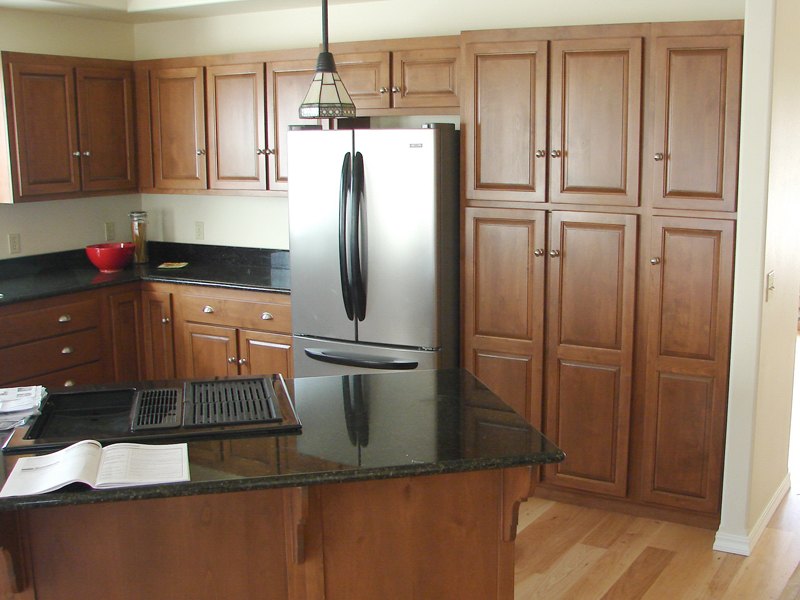 Alder kitchen cabinets in a cinnamon finish