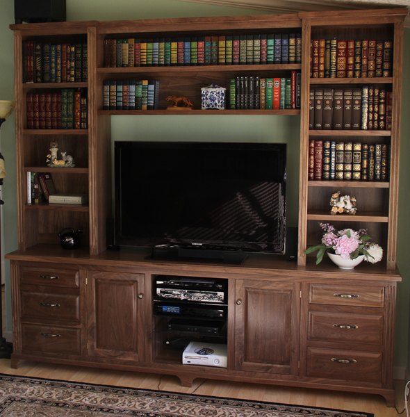 Walnut entertainment center with bookshelves, cabinets and drawers